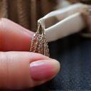 Hand stitching fabric, representing quality craftsmanship